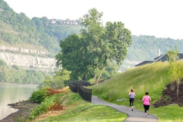 surrounding community with a water and mountain view