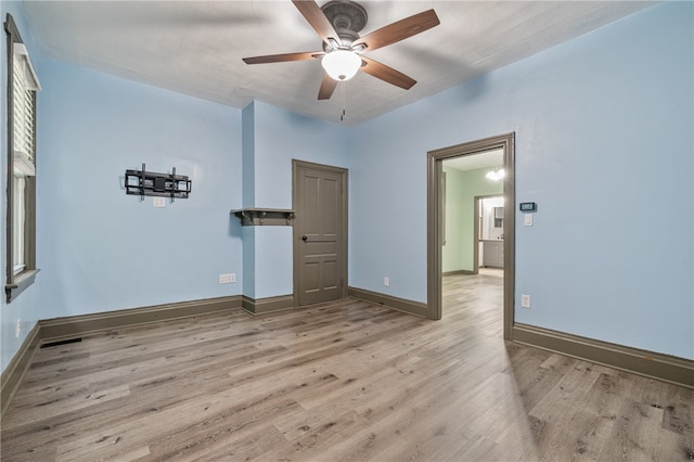 interior space with light hardwood / wood-style floors and ceiling fan