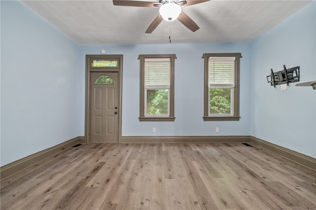 spare room with ceiling fan and light hardwood / wood-style floors