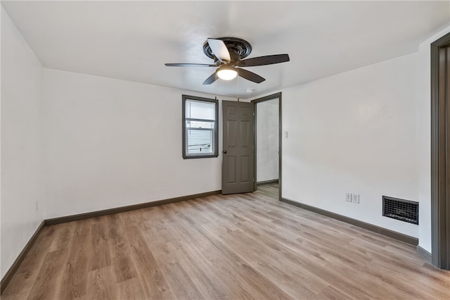 unfurnished room with light hardwood / wood-style flooring and ceiling fan