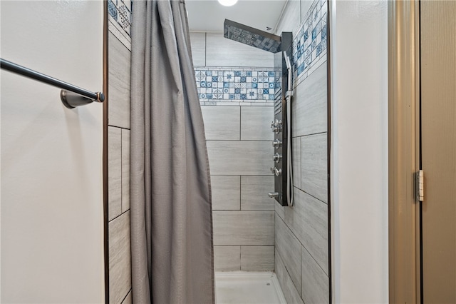 bathroom featuring a shower with curtain