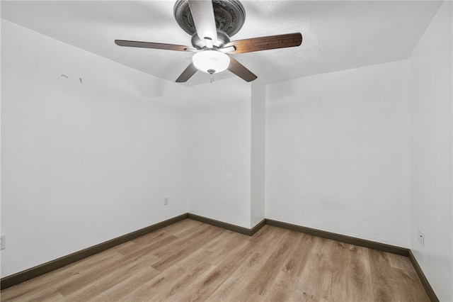 spare room with light hardwood / wood-style floors and ceiling fan