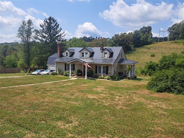 view of front of home featuring covered porch and a front lawn