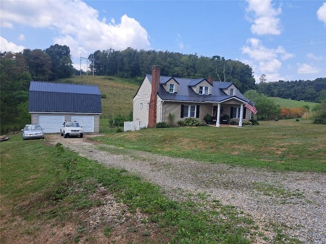 view of front facade with a front yard and covered porch