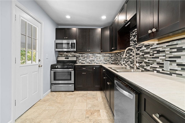 kitchen featuring light tile patterned flooring, stainless steel appliances, decorative backsplash, dark brown cabinetry, and sink