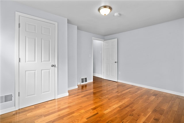 unfurnished bedroom featuring wood-type flooring