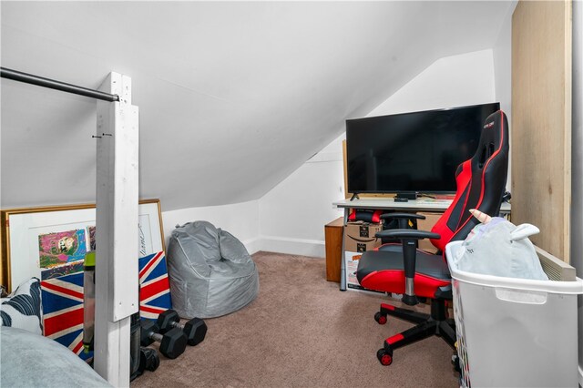 office area featuring vaulted ceiling and carpet floors