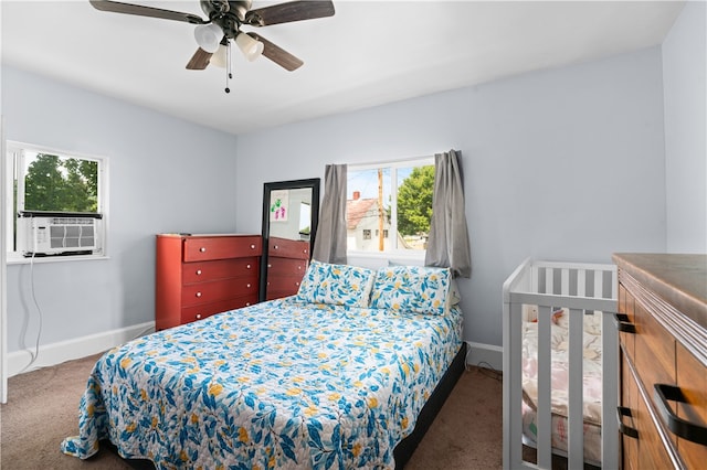 carpeted bedroom featuring cooling unit, multiple windows, and ceiling fan