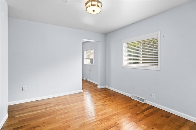 empty room with wood-type flooring