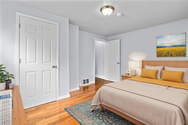 bedroom with hardwood / wood-style floors