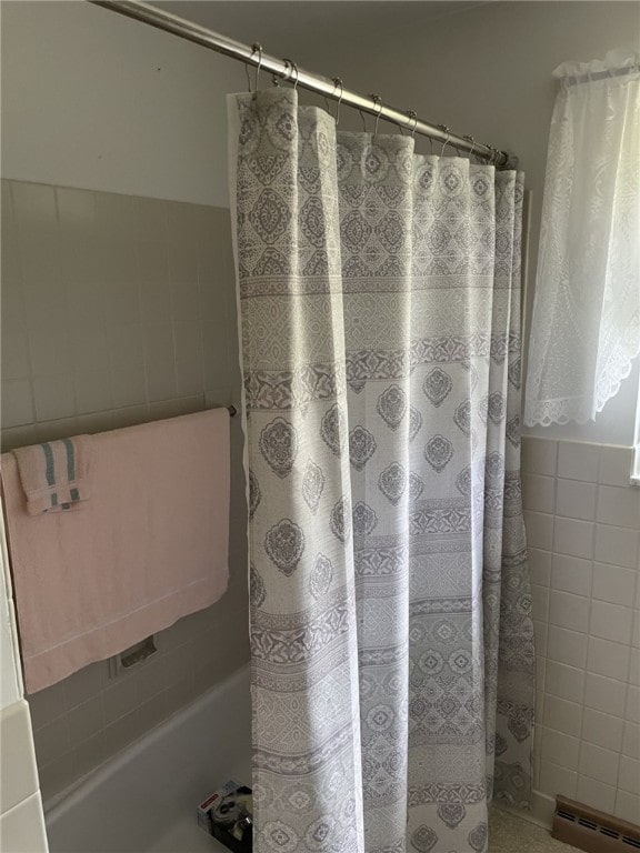 142 Greenridge Dr, Carroll Twp, PA 15063 - bathroom with tile walls, a baseboard heating unit, curtained shower, and wainscoting