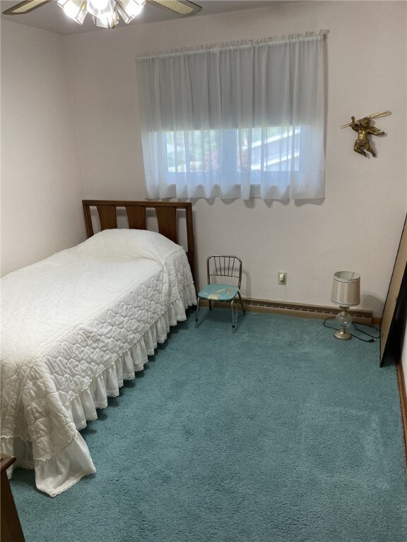 142 Greenridge Dr, Carroll Twp, PA 15063 - carpeted bedroom with ceiling fan