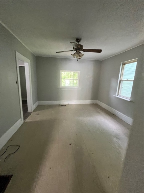 spare room featuring hardwood / wood-style flooring, a textured ceiling, and ceiling fan