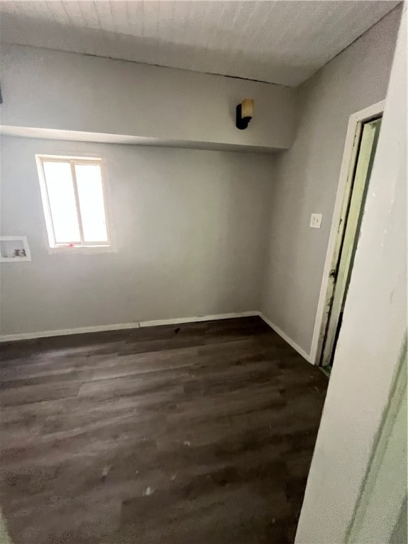 spare room featuring a textured ceiling and hardwood / wood-style floors