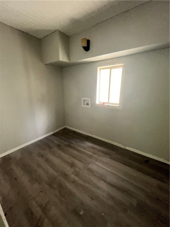 unfurnished room with hardwood / wood-style flooring