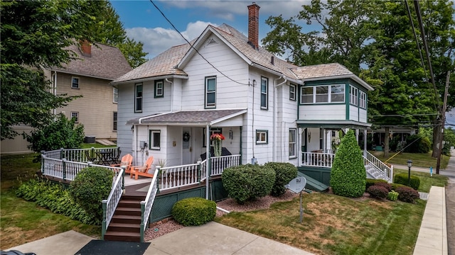 view of front of property featuring covered porch