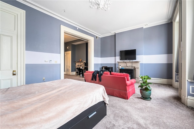 carpeted bedroom with ornamental molding