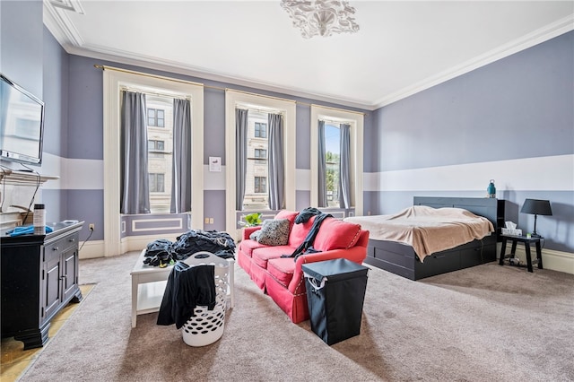 carpeted bedroom featuring crown molding