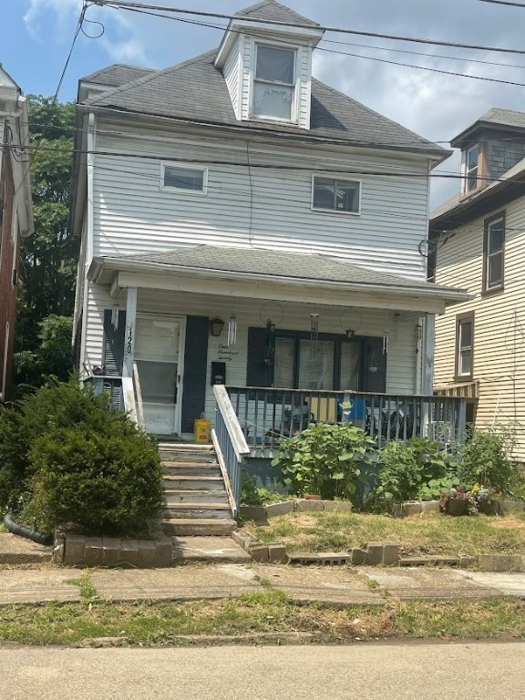 view of front of home featuring covered porch