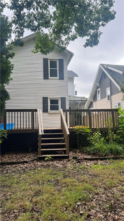 back of property with a wooden deck