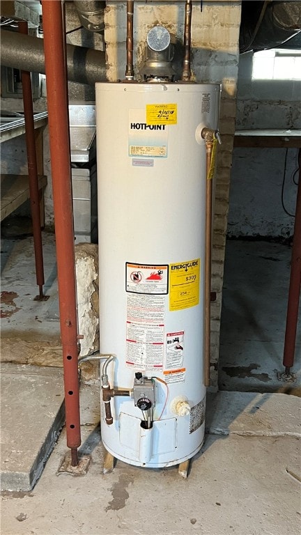 utility room featuring gas water heater