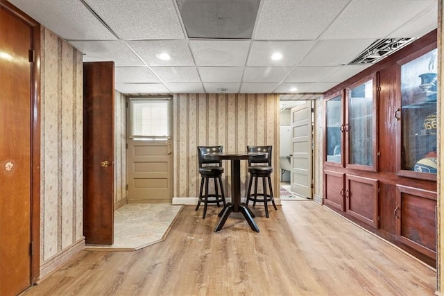 dining room with a paneled ceiling, recessed lighting, visible vents, baseboards, and light wood-type flooring