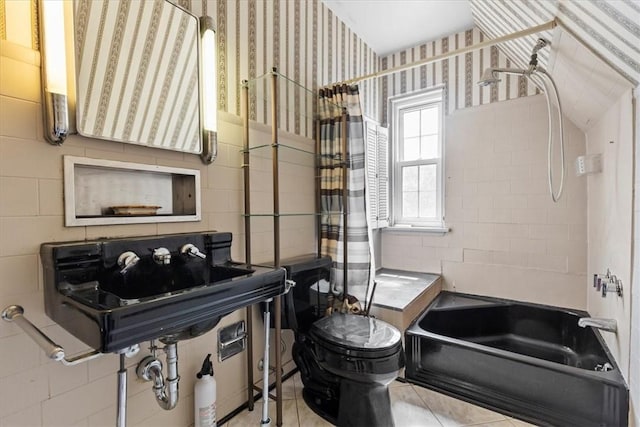 full bathroom featuring tile patterned flooring, toilet, a sink, shower / bath combo, and wallpapered walls