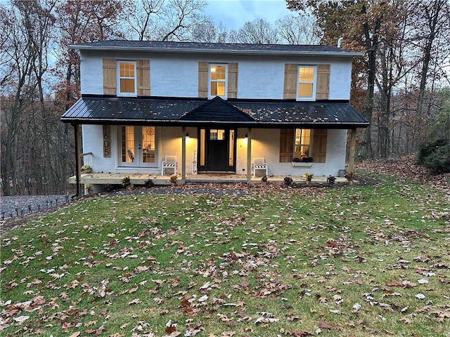 modern inspired farmhouse featuring french doors, a patio area, and a front yard