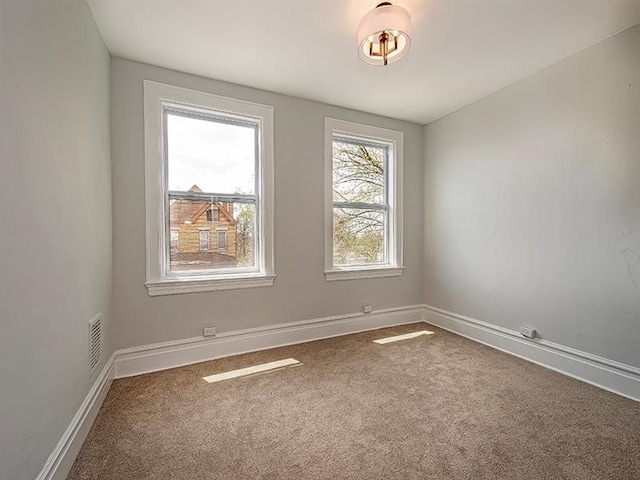 view of carpeted spare room