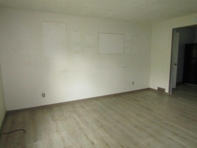 empty room with light wood-type flooring