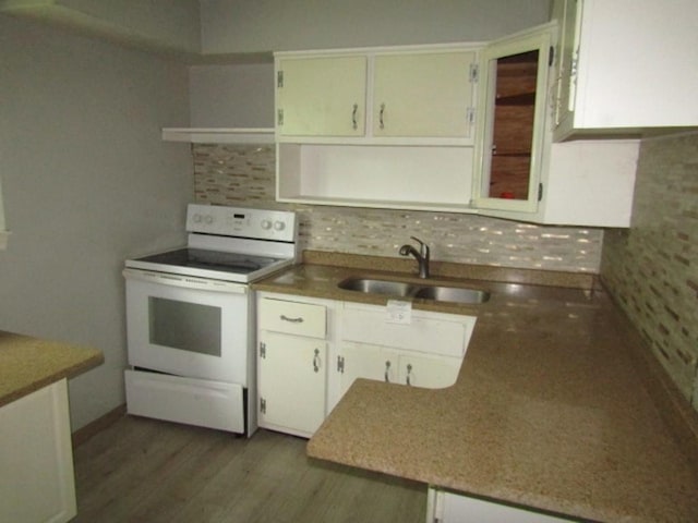 kitchen featuring sink, white cabinetry, electric range, dark hardwood / wood-style floors, and decorative backsplash