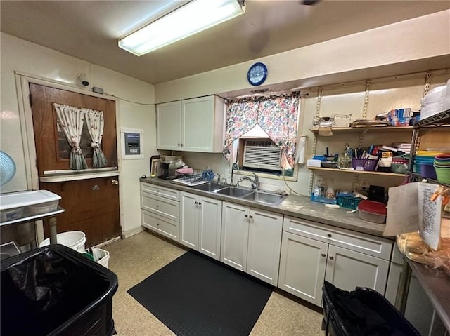 kitchen with sink and white cabinetry