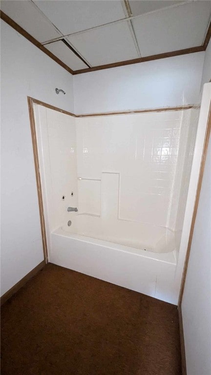 bathroom featuring a paneled ceiling and shower / bath combination