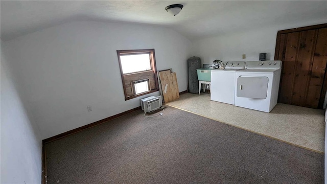 clothes washing area with washing machine and dryer, sink, and carpet floors