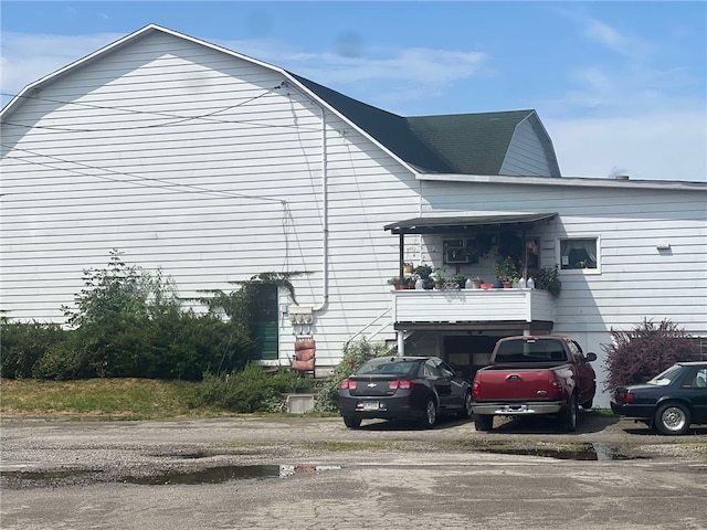 view of side of home with a balcony