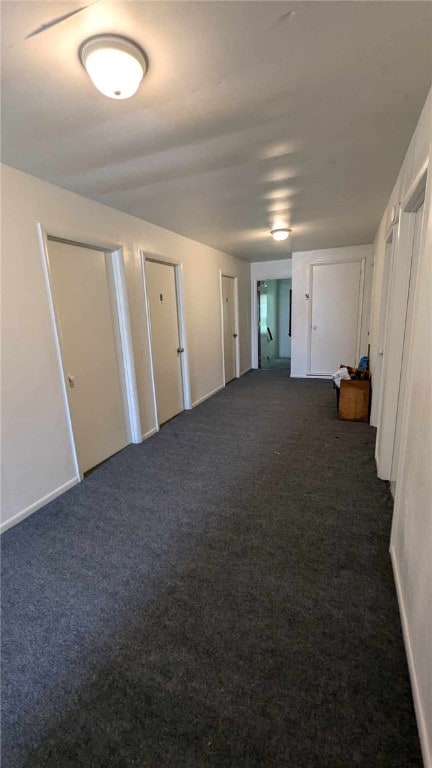 interior space featuring dark colored carpet