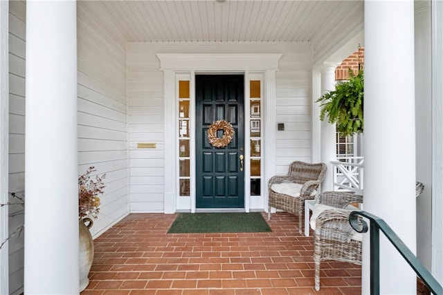 doorway to property featuring covered porch