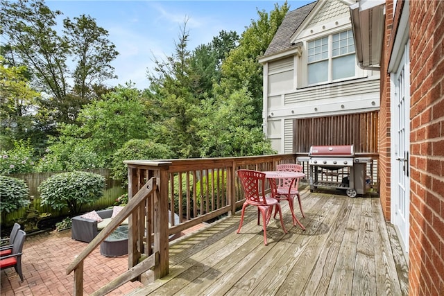 wooden deck featuring grilling area