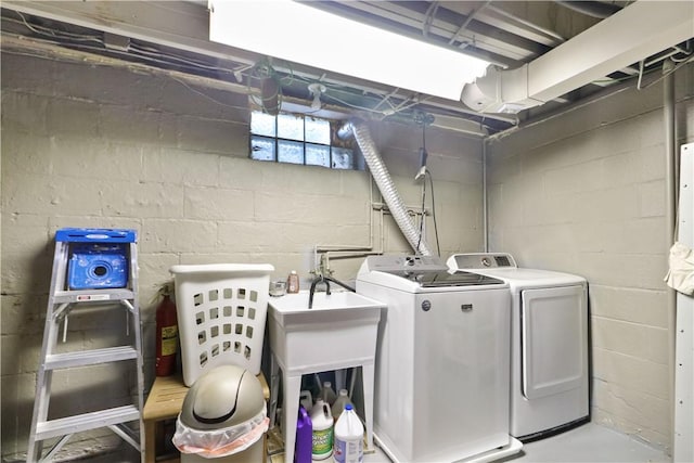 exercise room featuring washing machine and dryer and concrete flooring