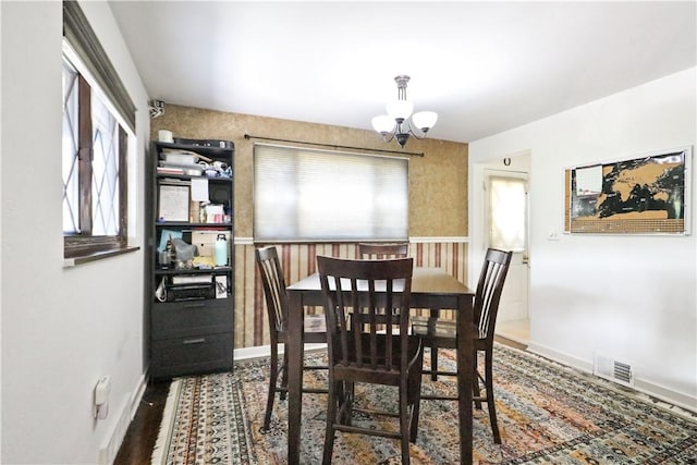 kitchen featuring black electric range, white cabinetry, and light tile patterned floors