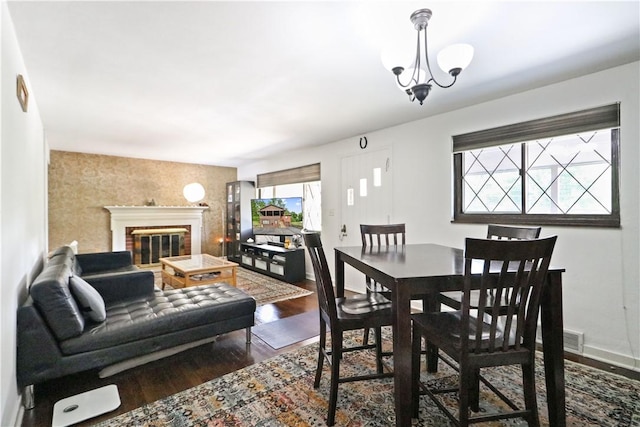 dining area featuring a chandelier and hardwood / wood-style flooring