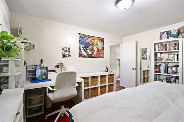 bedroom with light hardwood / wood-style flooring and a closet