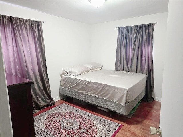 bedroom featuring dark wood-type flooring