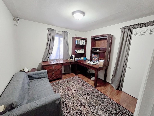 home office with wood-type flooring