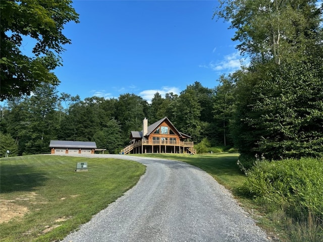 log-style house featuring a front lawn