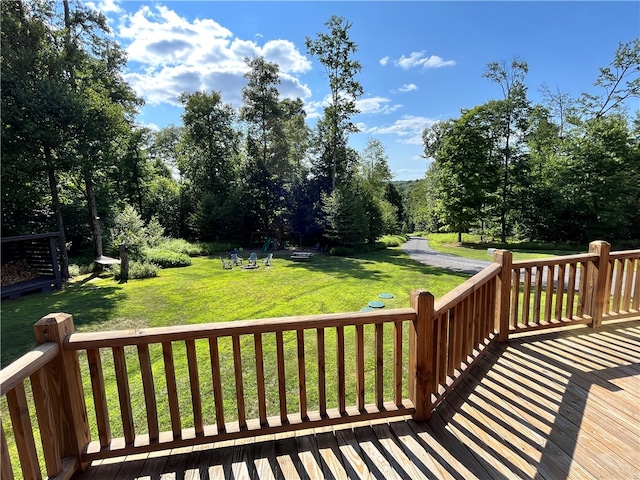 wooden terrace with a lawn