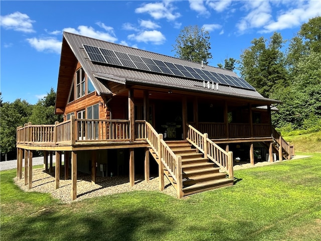 exterior space featuring a deck, a yard, and solar panels