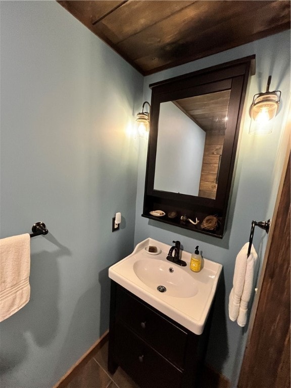 bathroom featuring wood ceiling, vanity, and tile patterned flooring