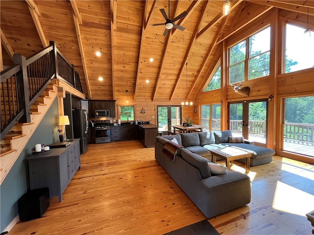 living room featuring wood ceiling, light hardwood / wood-style floors, beam ceiling, high vaulted ceiling, and wood walls