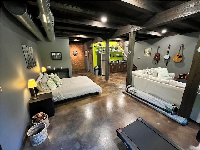 bedroom with concrete floors and beam ceiling